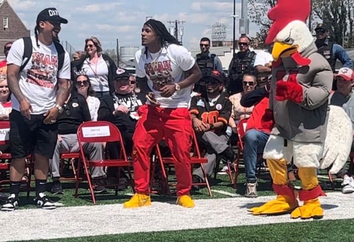 Isiah Pacheco, Vineland's favorite son and Super Bowl champion, shows off his dance moves with his father Julio Pacheco, left, and Vineland High School mascot Rowdy Rooster.